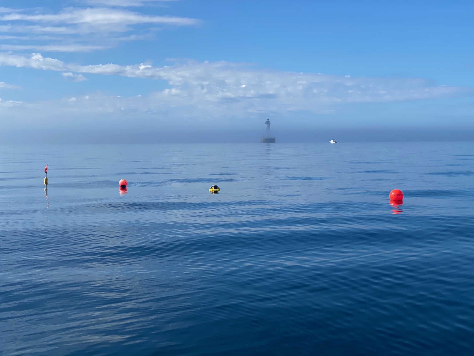 A Spotter buoy floats near Stannard Rock Lighthouse in Lake Superior